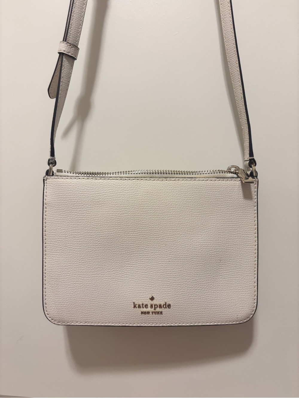 kate spade white pebbled leather crossbody with gold logo